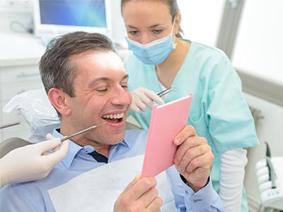 Ditmars Family Dental | Implant Dentistry, Root Canals and Dentures